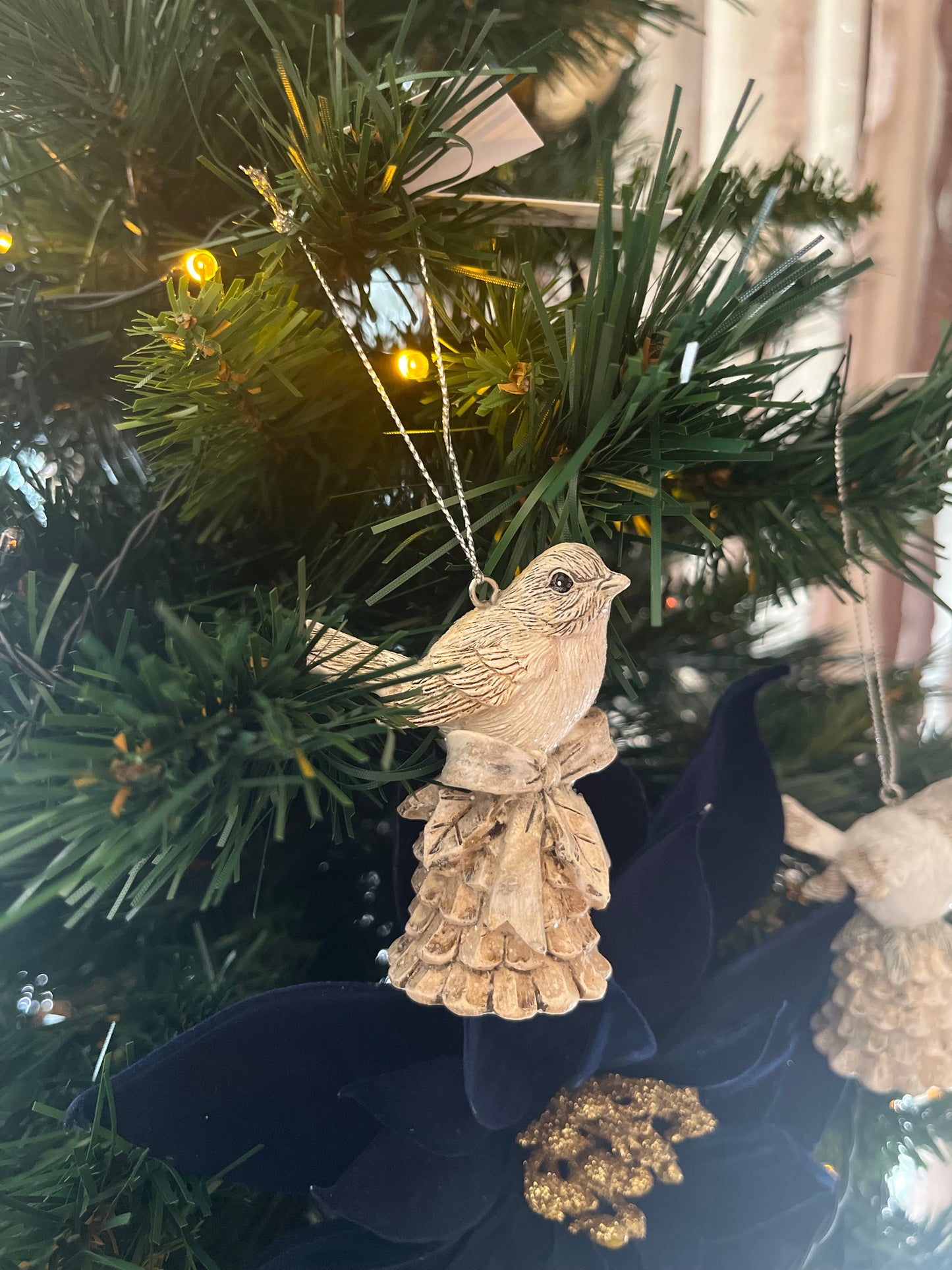 Figura de pájaro con campanita